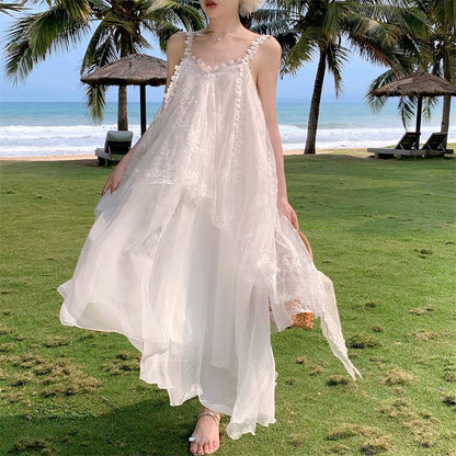 2025 high-end vacation style swinging dress female summer super fairy beautiful gentle wind fairy fringed suspender skirt